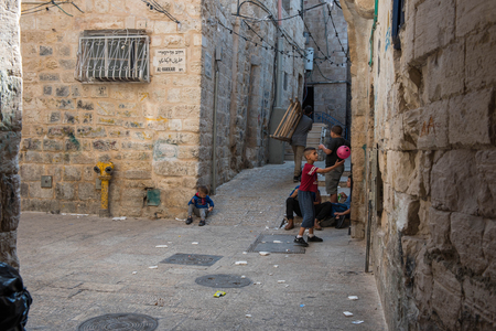 JERUSALEM, ISRAEL - MAY 15, 2018: Local Palestinian children playing in the Muslim Quarter of the cityのeditorial素材