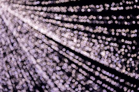 Abstract bokeh background of Christmas city lights. Blurred, defocused bright glowing circles on...