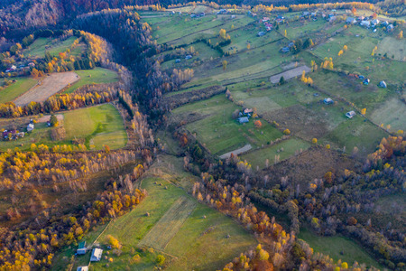 Aerial view of beautiful autumn hills and colorful forest from a drone. Transylvania, Romaniaの写真素材
