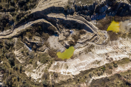 Industrial mining landscape from a drone. Aerial view of an abandoned open pit mine, nature pollutionの写真素材