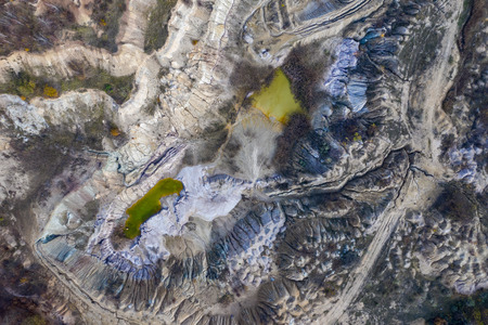 Industrial mining landscape from a drone. Aerial view of an abandoned open pit mine, nature pollutionの写真素材