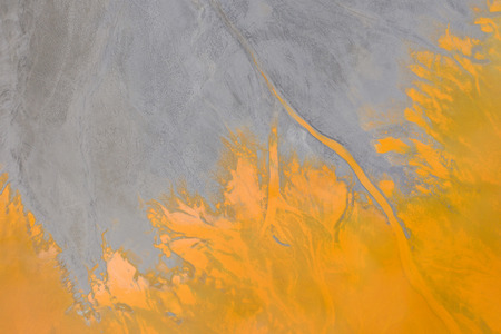 Aerial drone abstract view of water pollution of a copper mine exploitation. Natural patternの写真素材