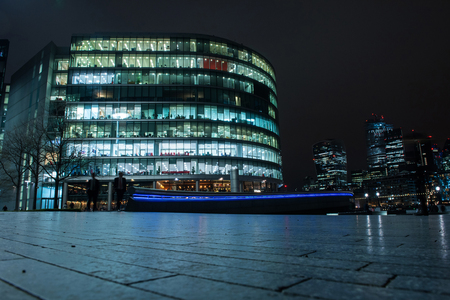 LONDON, UK - MARCH 22, 2019: The financial district of the town is called City of London and is illuminated every night by modern lightning systemsのeditorial素材