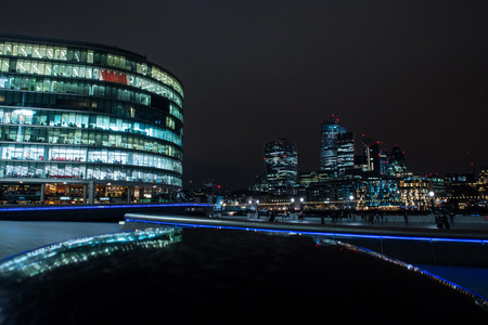 LONDON, UK - MARCH 22, 2019: The financial district of the town is called City of London and is illuminated every night by modern lightning systemsのeditorial素材