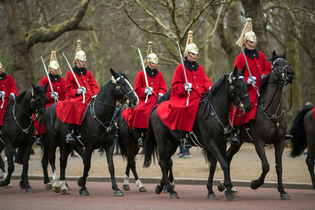 LONDON, UK - MARCH 22, 2019:  Household Cavalry Mounted Regiment riding their horses during the Changing the Guards military ceremony in Londonのeditorial素材