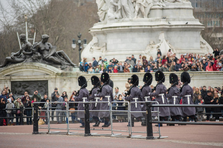 LONDON, UK - MARCH 22, 2019: The Royal Guards marching during the parade at the Changing of the Guard ceremony across Buckingham Palaceのeditorial素材