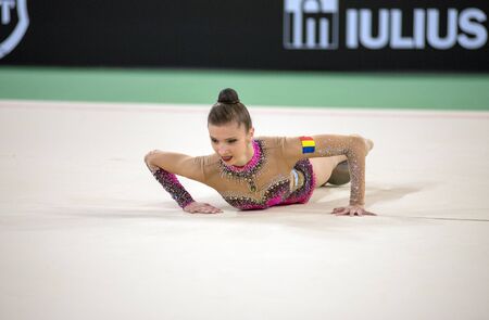 CLUJ, ROMANIA - JUNE 15, 2019: Young gymnasts performing different floor gymnastics exercise at Sports Festivalのeditorial素材