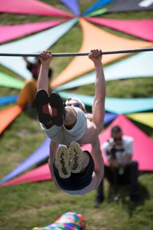 CLUJ, ROMANIA - JUNE 14, 2019: Street workout men performing a show outdoor during the Sports Festivalのeditorial素材