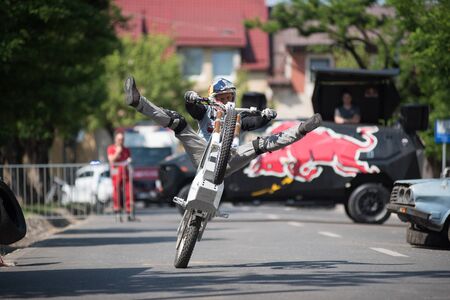 CLUJ, ROMANIA - JUNE 16, 2019: Legendary motorcyclist Chris Pfeiffer stunt riding doing a demonstration with a BMW electric motion bike at Sports Festivalのeditorial素材