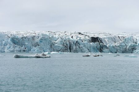 Melting icebergs as a result of global warming and climate change floating in Jokulsarlon glacial...