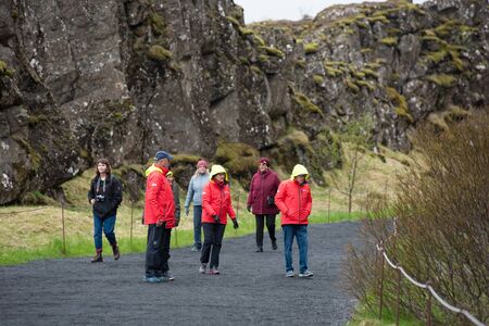 THINGVELLIR, ICELAND - MAY 20, 2019: Crowd of tourists visiting Thingvellir National Park a site of historical, cultural, and geological significanceのeditorial素材