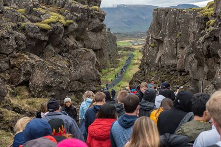THINGVELLIR, ICELAND - MAY 20, 2019: Crowd of tourists visiting Thingvellir National Park a site of historical, cultural, and geological significanceのeditorial素材
