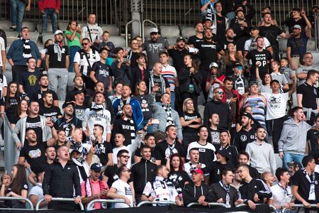 CLUJ NAPOCA, ROMANIA - JULY 12, 2019: Crowd of soccer supporters of U Cluj supporting their favorite football team in the tribune during a match against PAOK Salonikiのeditorial素材