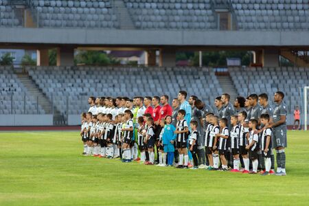 CLUJ NAPOCA, ROMANIA - JULY 12, 2019: Soccer players of Universitatea Cluj and PAOK Saloniki entering the field at the beginning of a friendly football match at Arena stadiumのeditorial素材