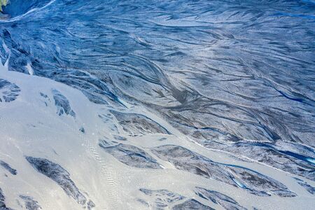Aerial drone view of a huge riverbed, melting glacier, Iceland. Global warming and climate change...