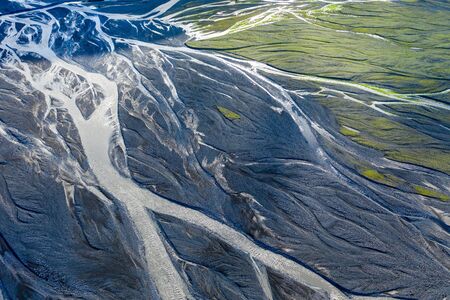 Aerial drone view of a huge riverbed, melting glacier, Iceland. Global warming and climate change...