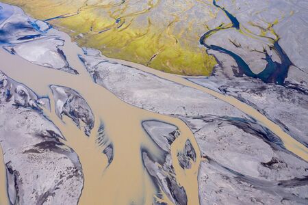 Aerial drone view of glacial river system transporting water from the melting glaciers of Vatnajokull, Iceland. Global warming and climate change conceptの写真素材