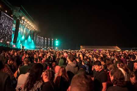 BONTIDA, ROMANIA - JULY 20, 2019: Crowd of young people partying during a Subcarpati live concert at...