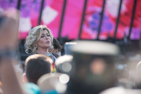 BONTIDA, ROMANIA - JULY 20, 2019: Romanian pop singer-songwriter Loredana singing live in the middle of the crowd at Electric Castle Festivalのeditorial素材