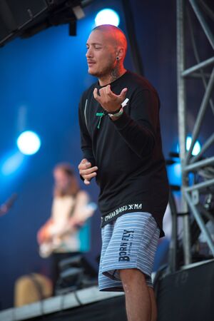 BONTIDA, ROMANIA - JULY 19, 2019: Sign language interpreter translating a song for persons with hearing impediment at Electric Castle festivalのeditorial素材
