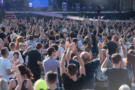 BONTIDA, ROMANIA - JULY 21, 2019: Crowd of cheerful people dancing and partying during a Suie Paparude concert at Electric Castle festivalのeditorial素材