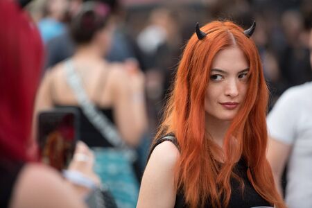 SIBIU, ROMANIA - JULY 27, 2019: Cheerful rocker girls enjoying the Artmania Metal Festivalのeditorial素材