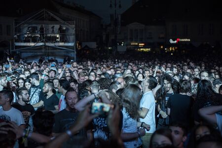 SIBIU, ROMANIA - JULY 26, 2019: Crowd of people headbanging and partying during an Architects rock concert at Artmania Festivalのeditorial素材