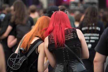 SIBIU, ROMANIA - JULY 27, 2019: Cheerful rocker girls enjoying the Artmania Metal Festivalのeditorial素材