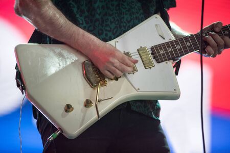 Guitarist playing live music on the stageの写真素材