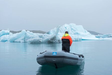 JOKULSARLON, ICELAND - MAY 23, 2019: Ranger guard patrolling in a boat at Jokulsarlon glacial lagoonのeditorial素材