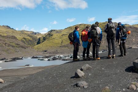 SOLHEIMAJOKULL, iCELAND - MAY 21, 2019: Tourists making a glacier hiking with a private tour guide in the Solheimajokull, Icelandのeditorial素材