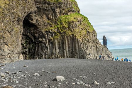 VIK, ICELAND - MAY 21, 2019: Tourists visiting the Reynisfjara beach and the basalt columns on the Atlantic coast of Southern Iceland in Vikのeditorial素材