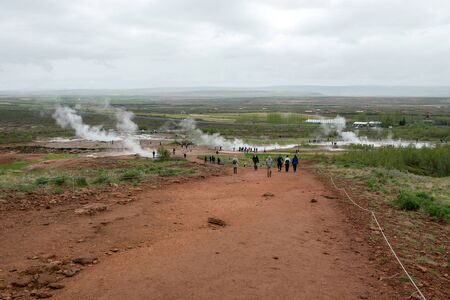 STROKKUR GEYSER, ICELAND - MAY 20, 2019: Tourists visiting and waiting for the eruption of Strokkur geyser in the Golden Circle of Icelandのeditorial素材
