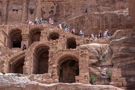 PETRA, JORDAN - MAY 18, 2018: Crowd of tourists visiting the archeological site and tombs of Petra, part of Unesco Heritageのeditorial素材