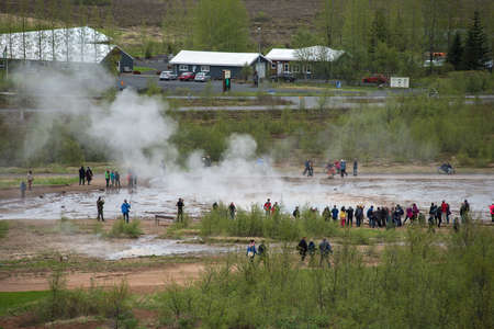 STROKKUR GEYSER, ICELAND - MAY 20, 2019: Tourists visiting and waiting for the eruption of Strokkur geyser in the Golden Circle of Icelandのeditorial素材