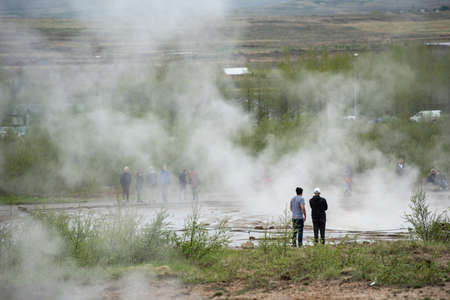 STROKKUR GEYSER, ICELAND - MAY 20, 2019: Tourists visiting and waiting for the eruption of Strokkur geyser in the Golden Circle of Icelandのeditorial素材
