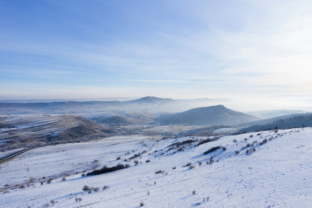 Aerial view of frozy winter landscape in a bright sunny dayの写真素材