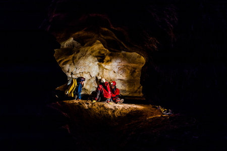 Group of speleologists resting during a cave explorationの写真素材