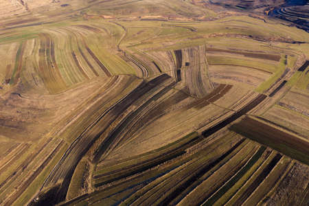 Above aerial view over agricultural fields in the autumnの写真素材