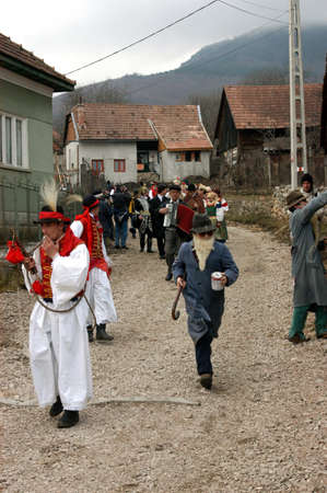 RIMETEA - FEBRUARY 28, 2004: Unidentified villagers of Rimetea,Torocko attending a unique show, the celebration and carnival at the end of winterのeditorial素材