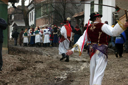 RIMETEA - FEBRUARY 28, 2004: Unidentified villagers of Rimetea,Torocko attending a unique show, the celebration and carnival at the end of winterのeditorial素材