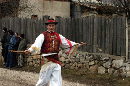 RIMETEA - FEBRUARY 28, 2004: Unidentified villagers of Rimetea,Torocko attending a unique show, the celebration and carnival at the end of winterのeditorial素材