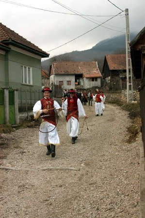 RIMETEA - FEBRUARY 28, 2004: Unidentified villagers of Rimetea,Torocko attending a unique show, the celebration and carnival at the end of winterのeditorial素材