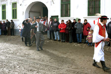 RIMETEA - FEBRUARY 28, 2004: Unidentified villagers of Rimetea,Torocko attending a unique show, the celebration and carnival at the end of winterのeditorial素材