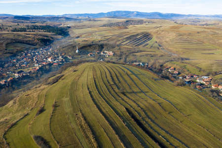 Aerial view of a small countryside village in the autumn. Bedeciu, Romaniaの写真素材