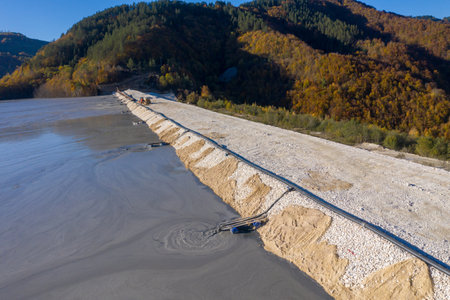 Aerial view of heavy metal contamination from a copper mine. Mining residual waters discharging into decanting pond. Geamana, Romaniaの写真素材