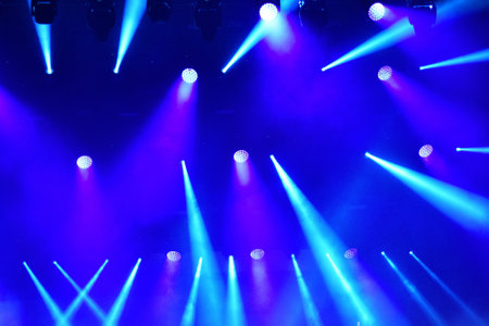 Stage lights glowing in the darkの写真素材
