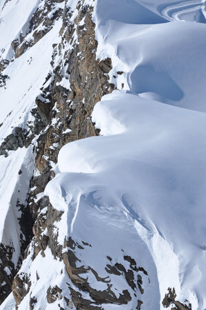 Snow covered mountain slopes in the Alps. Extreme freeride ski pisteの写真素材