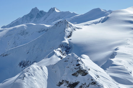 Snow covered mountain slopes in the Alps. Extreme freeride ski pisteの写真素材