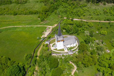 Aerial drone view of Valeni (Magyarvalko) Hungarian reformed church, Transylvania, Romaniaの写真素材